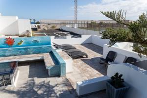 a pool on the roof of a building at ITY House in Playa Honda