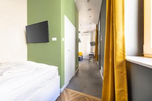Posteľ alebo postele v izbe v ubytovaní MioMio Apartments