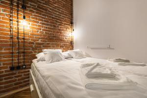 Posteľ alebo postele v izbe v ubytovaní MioMio Apartments