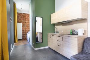 Kuchyňa alebo kuchynka v ubytovaní MioMio Apartments