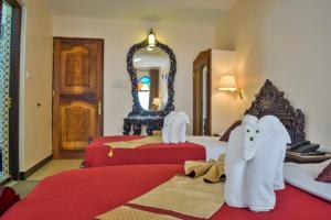 Voodi või voodid majutusasutuse Tembo Palace Hotel toas