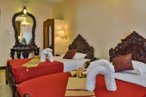 Voodi või voodid majutusasutuse Tembo Palace Hotel toas