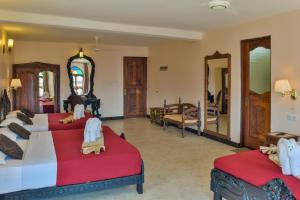 Voodi või voodid majutusasutuse Tembo Palace Hotel toas