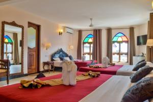 Voodi või voodid majutusasutuse Tembo Palace Hotel toas