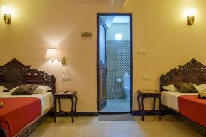 Voodi või voodid majutusasutuse Tembo Palace Hotel toas