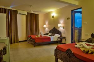 Voodi või voodid majutusasutuse Tembo Palace Hotel toas