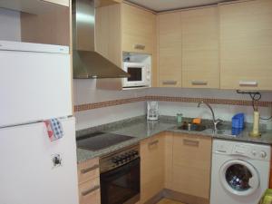 A kitchen or kitchenette at Apartamentos Saila