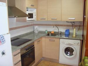 A kitchen or kitchenette at Apartamentos Saila
