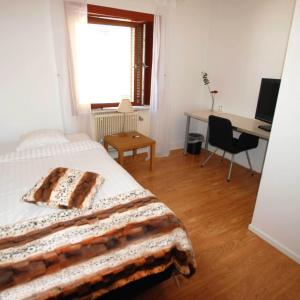 Postel nebo postele na pokoji v ubytování Avesta Stadshotell