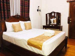 Postel nebo postele na pokoji v ubytování My Vigan Home Hotel