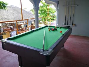 a pool table in the middle of a room at Villa Carillo Beach Resort in Placer