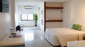 Postel nebo postele na pokoji v ubytování Hotel & Suites Arges - Centro Chetumal