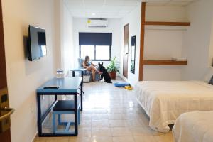 Postel nebo postele na pokoji v ubytování Hotel & Suites Arges - Centro Chetumal