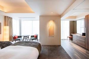 Postel nebo postele na pokoji v ubytování karaksa hotel premier Tokyo Ginza