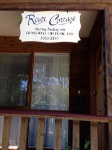 a sign above a window of a building at RiverCottage-selfcontained in Marysville