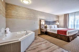 Postel nebo postele na pokoji v ubytování Comfort Inn & Suites South