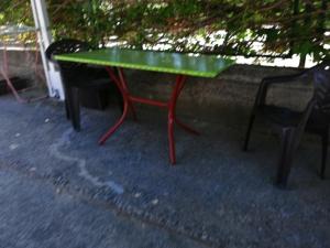 a green and red table and a black chair at Aleksandar in Sutomore
