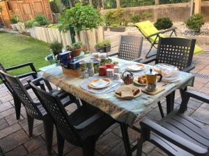 a table with food on it on a patio at Oasi di Laura a Balerna in Balerna