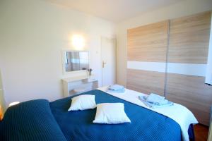 Posteľ alebo postele v izbe v ubytovaní Apartment Agnese