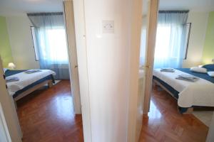 Posteľ alebo postele v izbe v ubytovaní Apartment Agnese