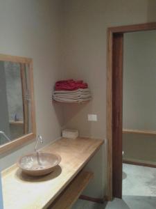 a bathroom with a bowl sink on a counter at maison au zenit in Maceio