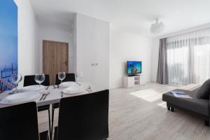 TV a/nebo společenská místnost v ubytování Nowe Apartamenty Puck