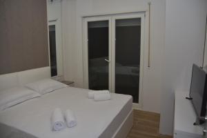 Airen Hotel Velipoje 객실 침대