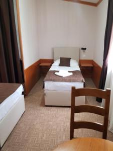 Postel nebo postele na pokoji v ubytování Hotel Yugoslavia