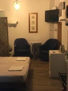 TV a/nebo společenská místnost v ubytování MOTEL KATERINA