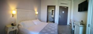 Letto o letti in una camera di Hotel Puglia Garden