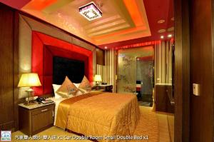Postel nebo postele na pokoji v ubytování Zheng Yi Classic Hotel & Motel