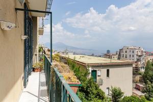 a balcony with a view of a city at Salvator Rosa Metro station Flat in Naples