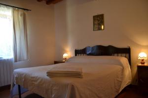 Postel nebo postele na pokoji v ubytování Agriturismo La Querce