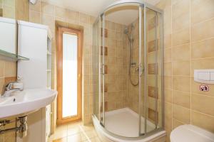a bathroom with a shower and a sink at Vila PRI Rouzes in Palanga +116 photos