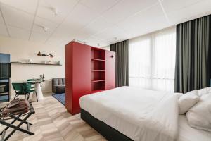 Postel nebo postele na pokoji v ubytování ROXI The Urban Residence Brussels