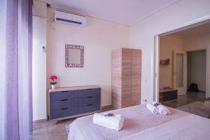 Ένα ή περισσότερα κρεβάτια σε δωμάτιο στο Comfort Mitropoleos Apartment