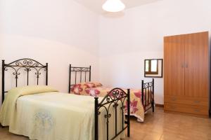 Ένα ή περισσότερα κρεβάτια σε δωμάτιο στο Villa Limoni 7 posti letto - San Foca