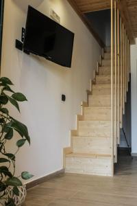 Телевизор и/или развлекательный центр в La Dimora apartments