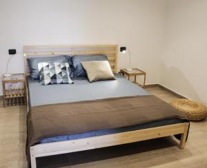 Кровать или кровати в номере La Dimora apartments