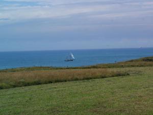 a sail boat in the ocean on the water at Wonderful holiday home in Audinghen with garden in Audinghen
