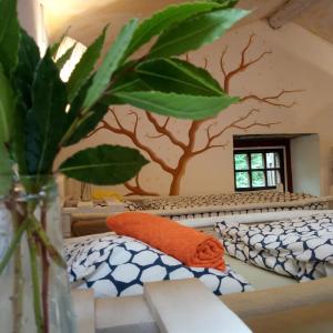 a room with a tree mural on the wall at Watermill Moinho Garcia in Pinheiro da Bemposta