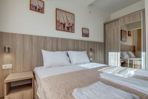 A bed or beds in a room at Adriatik Lux Apartments