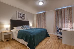 Postel nebo postele na pokoji v ubytování Trondheim Leilighetshotel