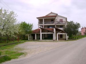 a large house on the side of a road at Guest House Robi in Međugorje