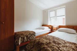 Posteľ alebo postele v izbe v ubytovaní Apartamenty Gromada Międzyzdroje