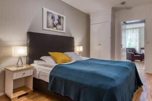 Postel nebo postele na pokoji v ubytování Trondheim Leilighetshotel
