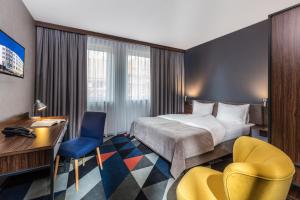 Postel nebo postele na pokoji v ubytování Vulcan Hotel + 26 fotografií