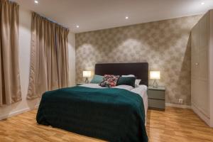Postel nebo postele na pokoji v ubytování Trondheim Leilighetshotel