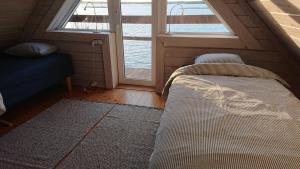 Voodi või voodid majutusasutuse Seaside cottage toas