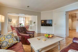TV a/nebo společenská místnost v ubytování Trondheim Leilighetshotel